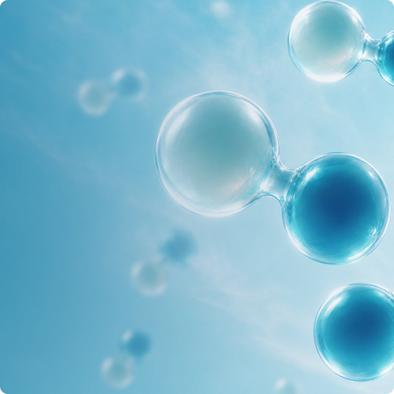Abstract blue and clear glass bubble or droplet shapes floating on a soft light blue background.